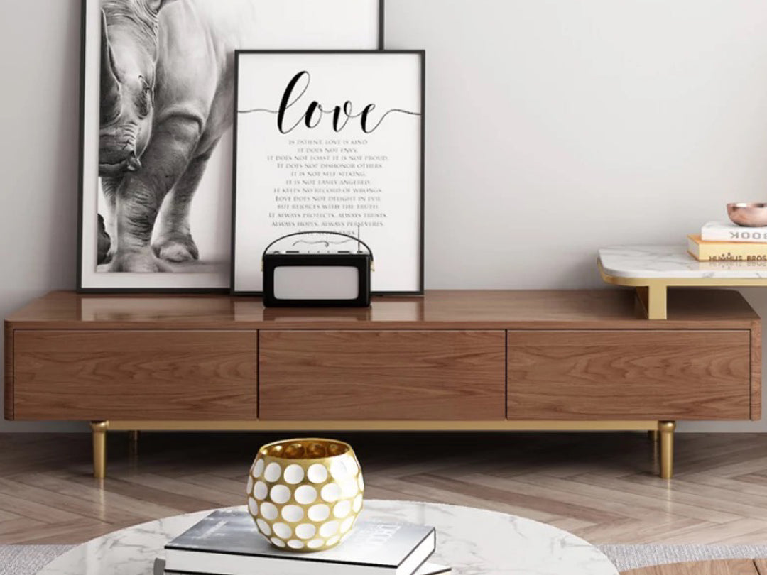 Wooden entertainment console with decorative items in a living room.