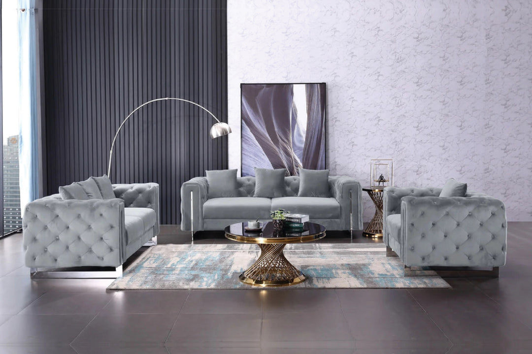 Modern living room with gray sofa set and decorative rug.