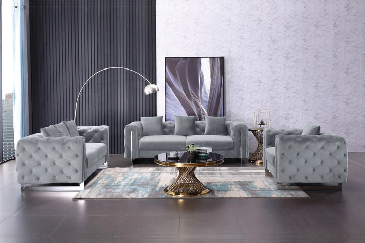 Modern living room with gray sofa set and decorative rug.