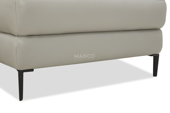 Gray sofa with 'MARCO' branding on a white background