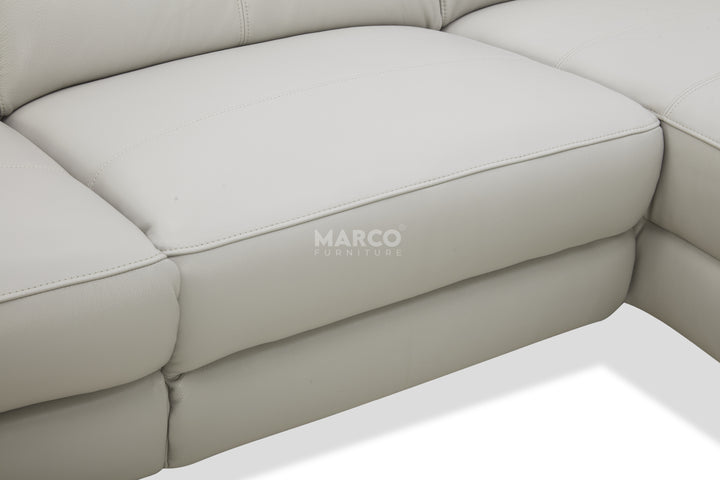 Beige corner sofa with 'MARCO' branding on a white background