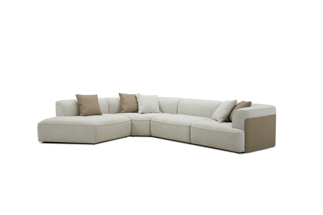 Beige sectional sofa with brown cushions on a white background