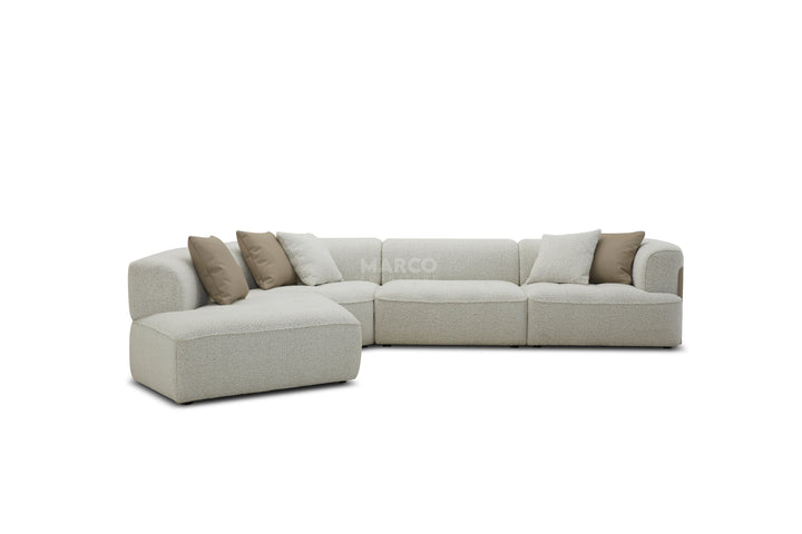 Gray sectional sofa with brown cushions on a white background, featuring the brand 'Marco'.
