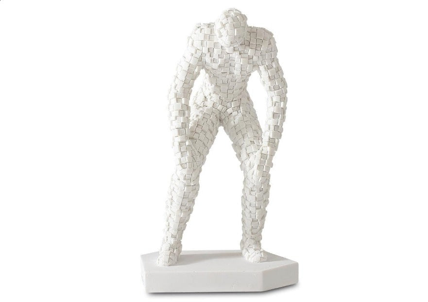 A white mosaic texture figurine of a standing person with arms crossed, displayed on a white base.