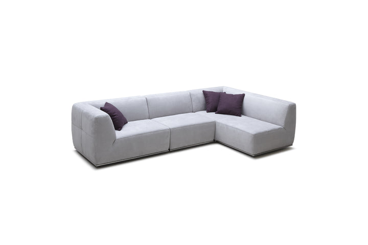 Gray sectional sofa with purple cushions on a white background