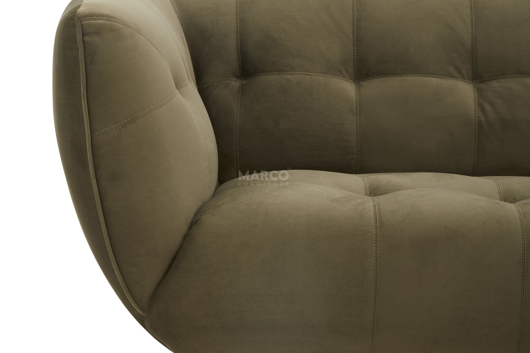 Brown upholstered chair with tufted design on a white background