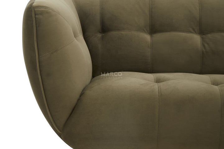 Brown upholstered chair with tufted design on a white background