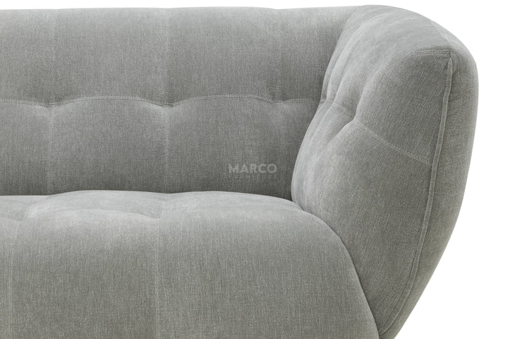 Gray sofa with 'MARCO' branding on a white background