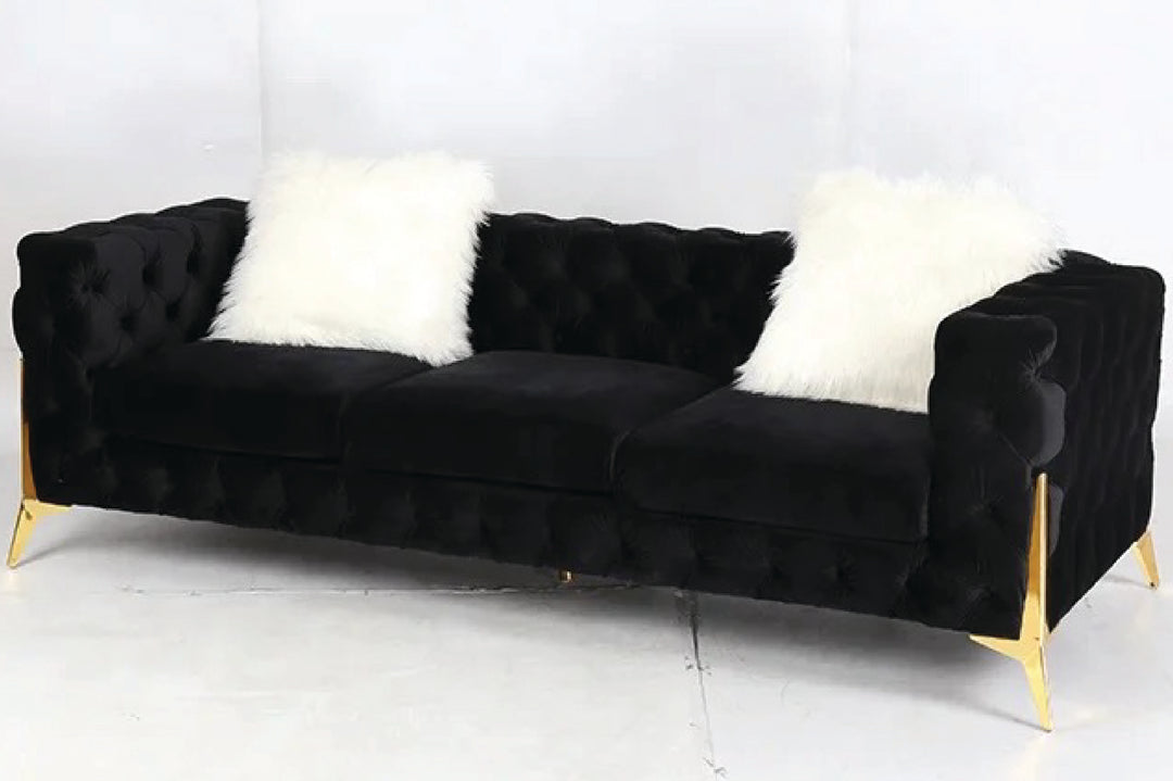 Black sofa with white cushions on a white background