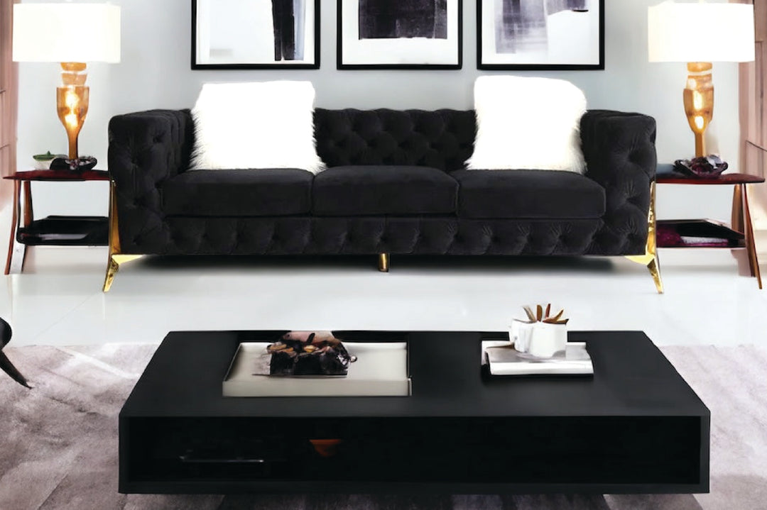 Modern living room with a black sofa and coffee table.