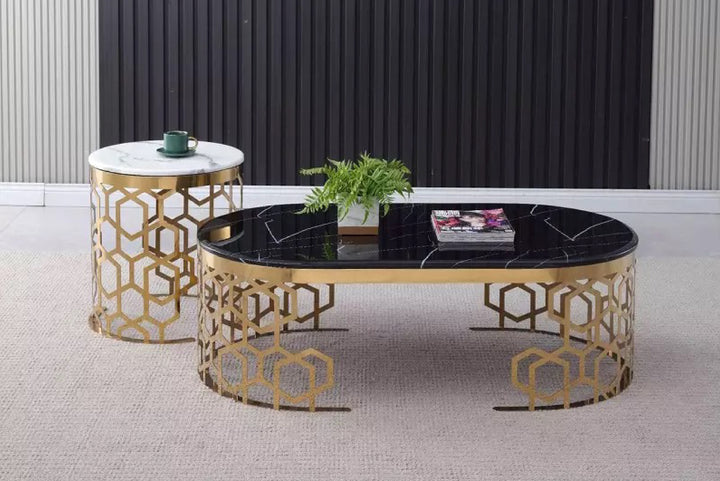Decorative coffee table with gold geometric design and black marble surface in a room.