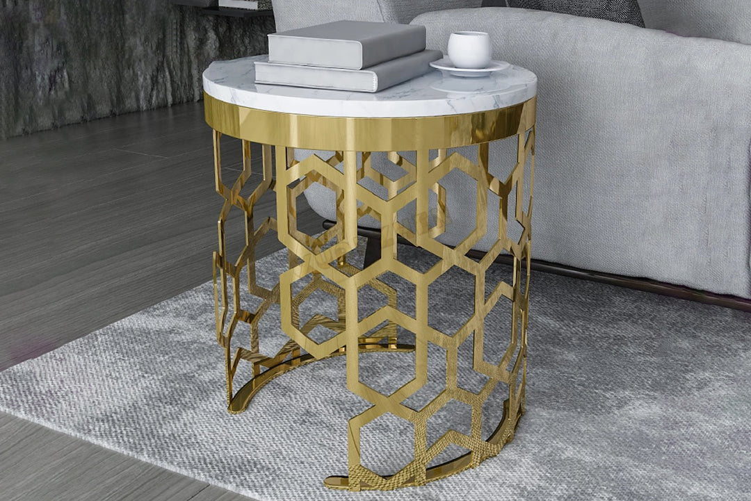 Gold side table with marble top in a living room setting