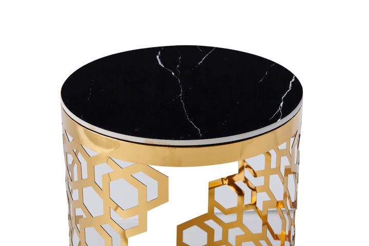 Decorative side table with black marble top and gold geometric pattern on base