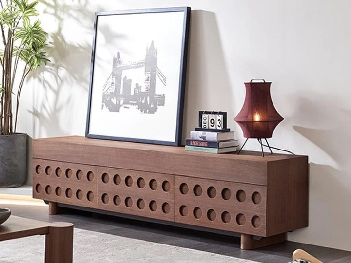 Wooden sideboard with decorative items in a living room.