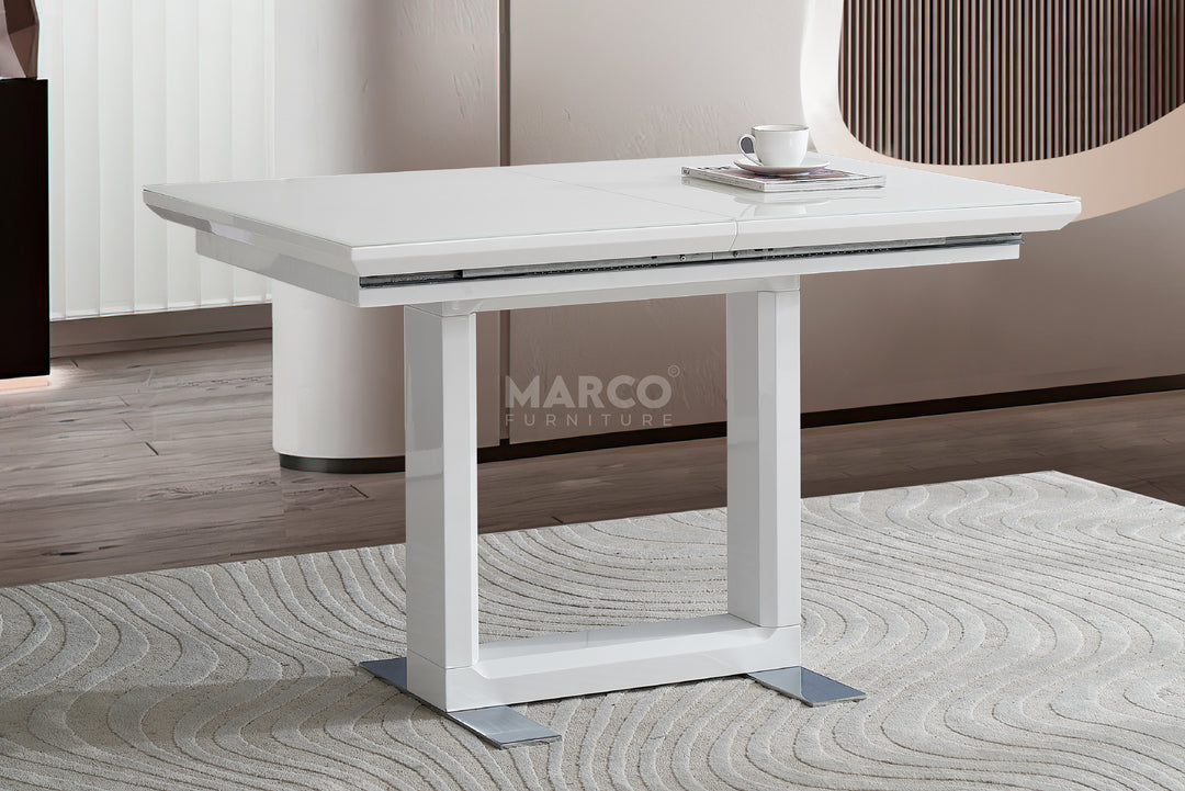 White dining table with marble-like surface in a modern interior.