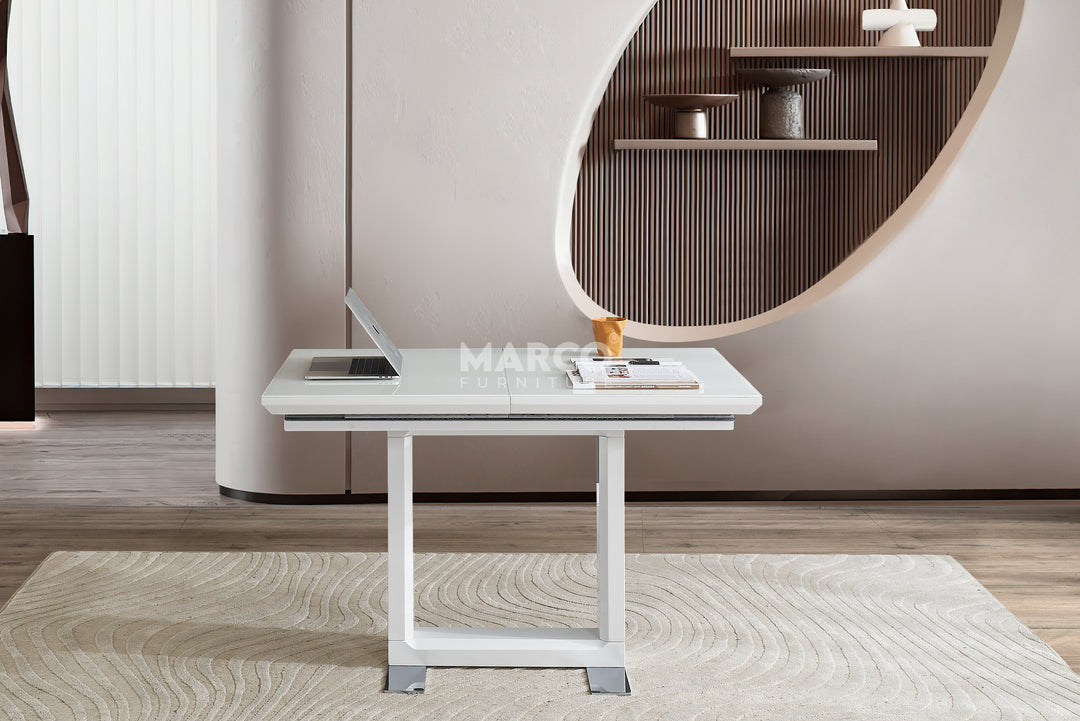 White desk with a laptop in a modern room.