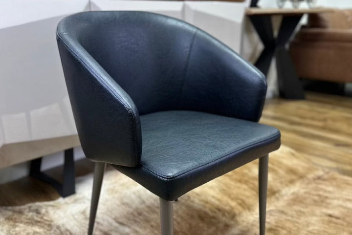 Leo Faux Leather Dining Chair with Curved Backrest & Steel Legs