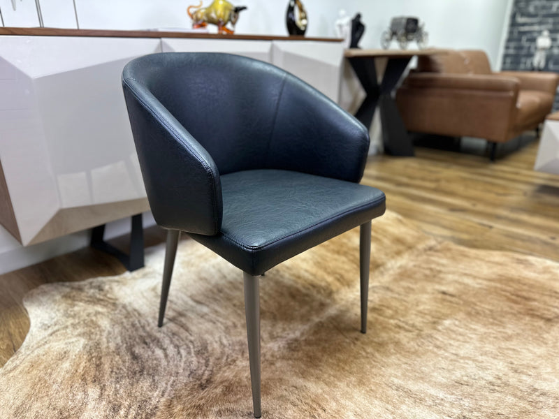 Leo Modern Dining Chair with Curved Backrest, PVC Leather, and Stainless Steel Carbon Legs