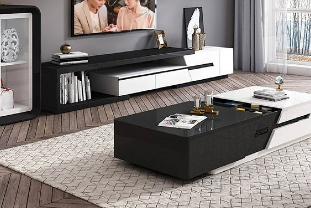 Modern living room with a black and white coffee table in the foreground.