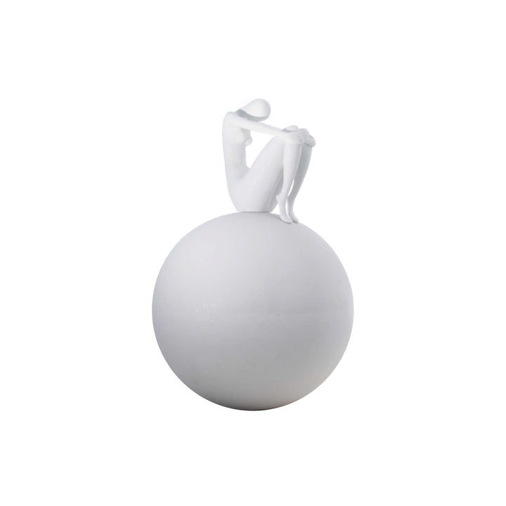 A modern sculpture of a seated female figure on a spherical base, primarily in white color.