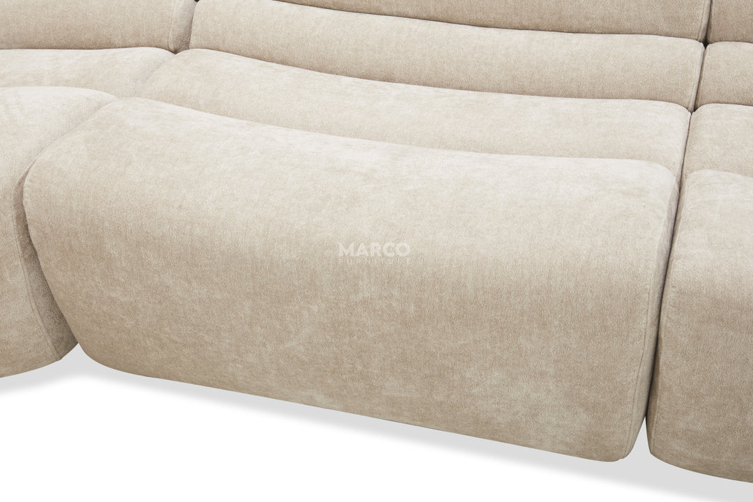 Beige sofa with 'MARCO' branding on a white background