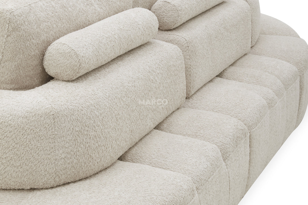Beige sofa with a textured fabric finish on a white background