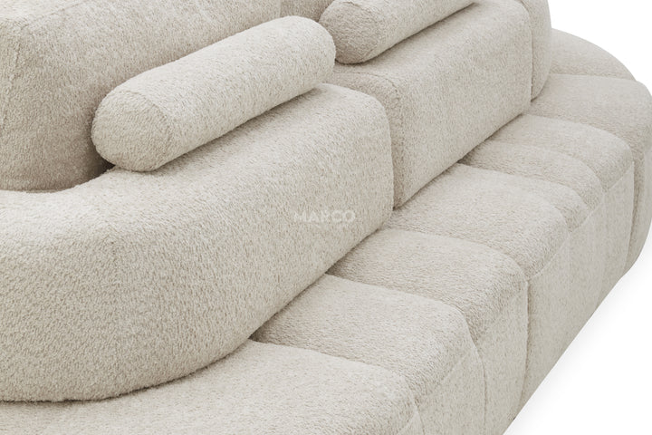 Beige sofa with a textured fabric finish on a white background