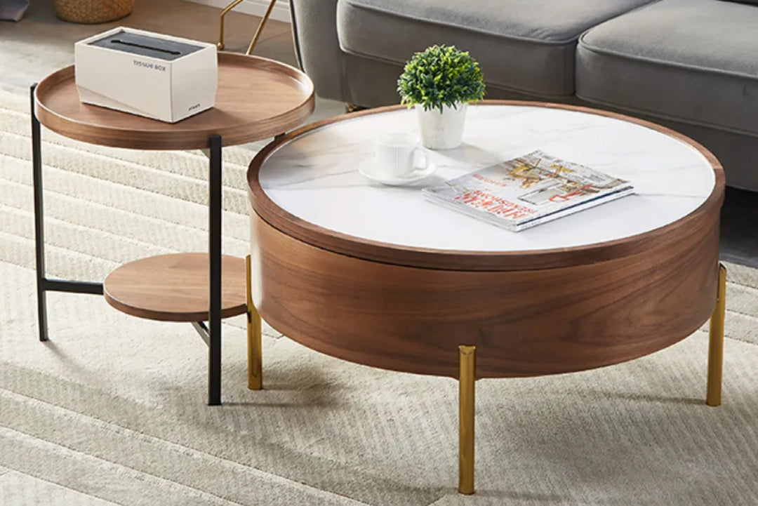 Round wooden coffee table with white top in a living room.