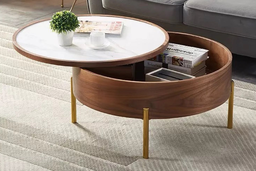 Round wooden coffee table with white top in a living room.
