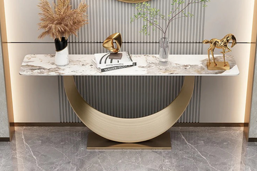 Modern console table with marble top and decorative items in a stylish interior setting.