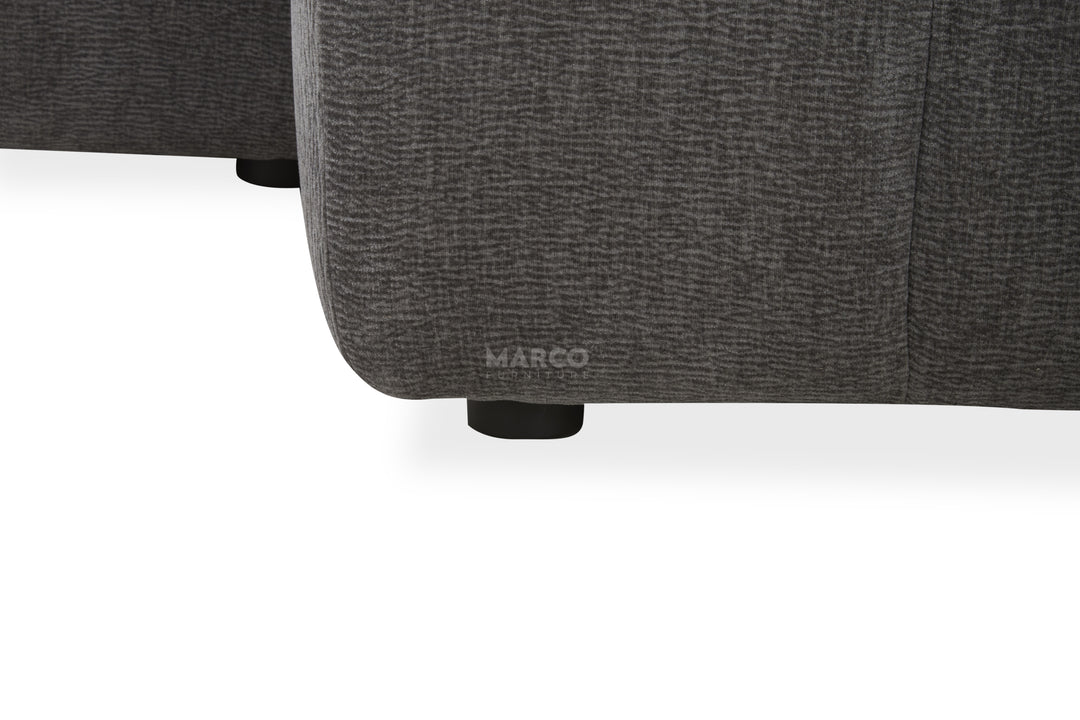 Gray upholstered chair with 'MARCO' branding on a white background