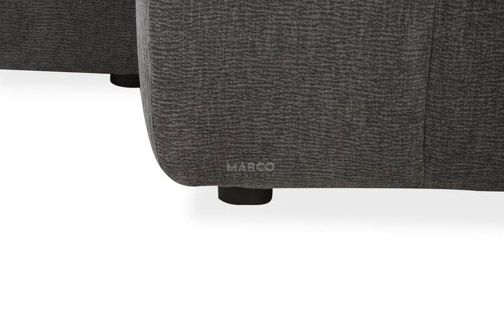 Gray upholstered chair with 'MARCO' branding on a white background
