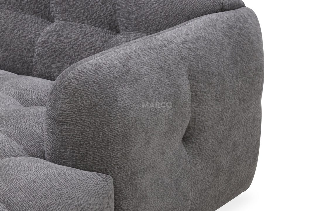 Gray upholstered chair with 'MARCO' branding on a white background