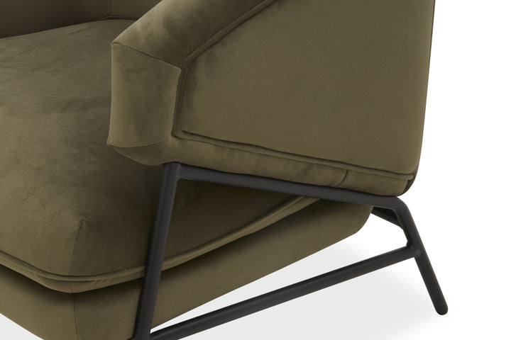 Green upholstered chair with metal legs on a white background