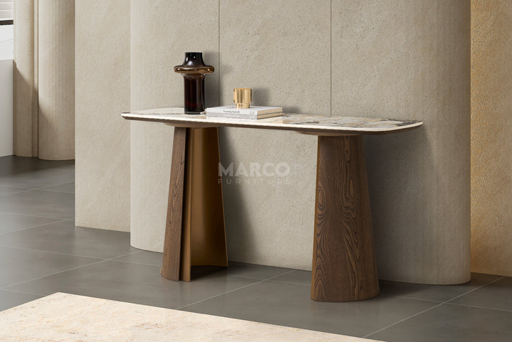 Modern bathroom vanity with marble countertop and wooden legs against a neutral wall.