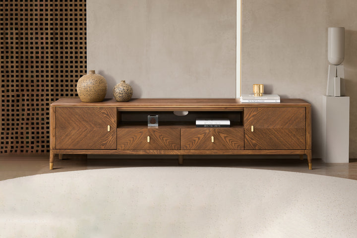 A modern TV unit with storage in a warm walnut brown color, featuring natural ash veneer finish with brushed stainless steel accents, two drawers and two cabinets.