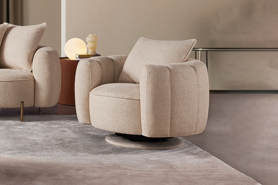 Beige armchair in a modern living room setting with a neutral color palette.