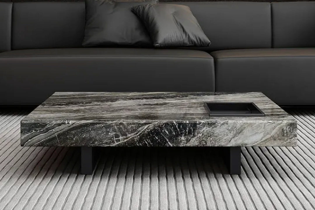 Coffee table with marble-like finish in a living room.