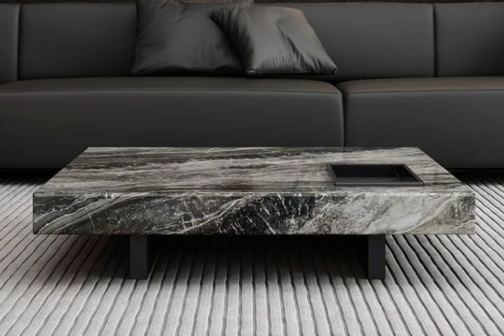 Coffee table with marble-like finish in a living room.
