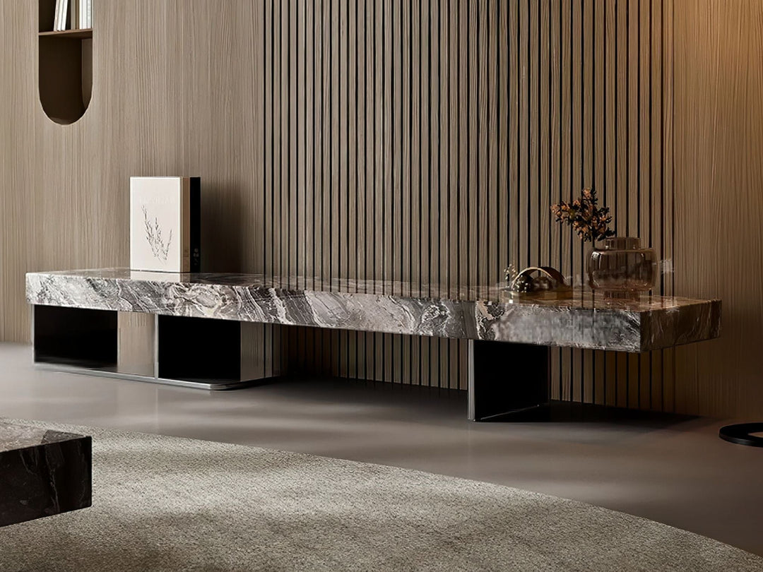 Modern marble coffee table in a stylish room with wooden walls and a rug.