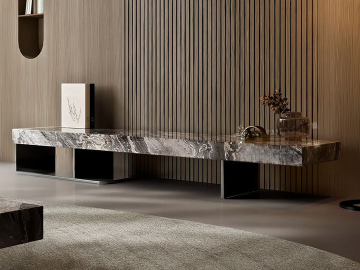 Modern marble coffee table in a stylish room with wooden walls and a rug.