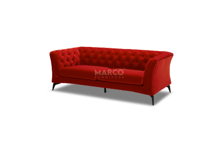 Red sofa with tufted backrest on a white background, branded 'Marco'.
