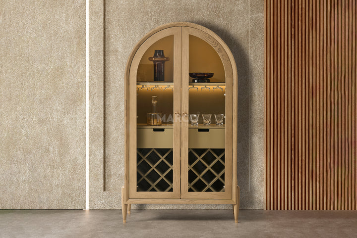 Wooden bar cabinet with mirrored doors against a textured wall.