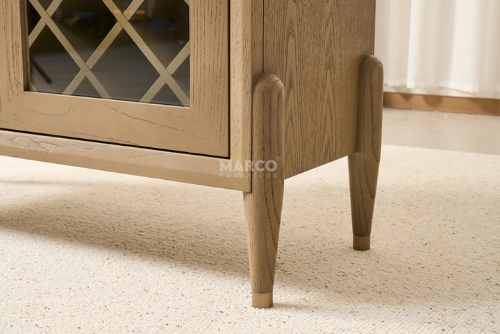 Wooden cabinet with glass panel on a light carpet
