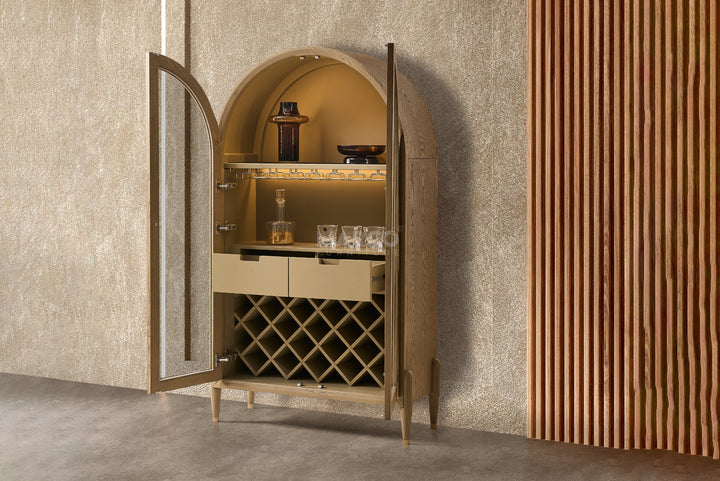 Wine cabinet with open doors displaying glasses and bottles against a textured wall.