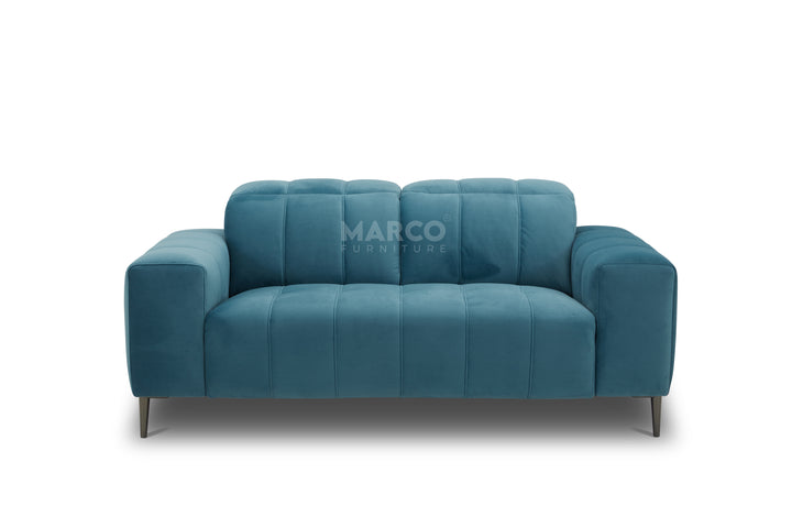 Blue sofa with 'Marco Furniture' branding on a white background
