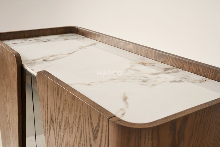 Wooden table with marble-like surface and 'MARCO' branding.