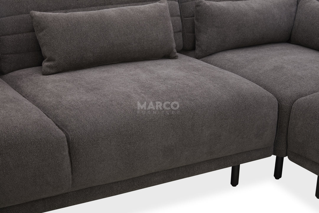 Gray sectional sofa with 'Marco' branding on a white background