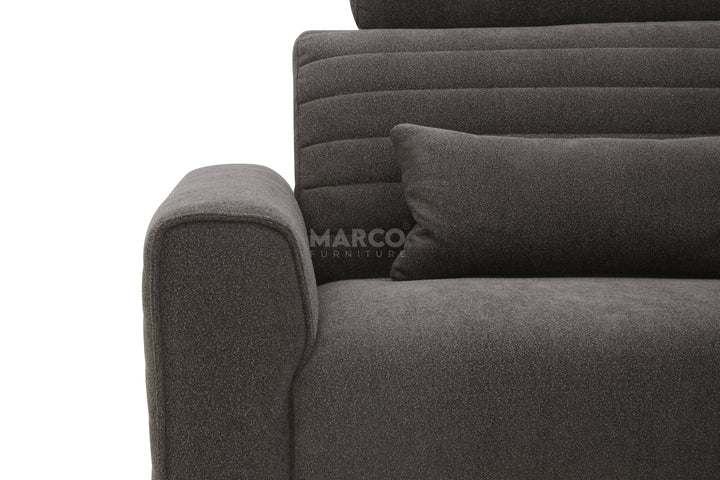 Gray sofa with a pillow on a white background