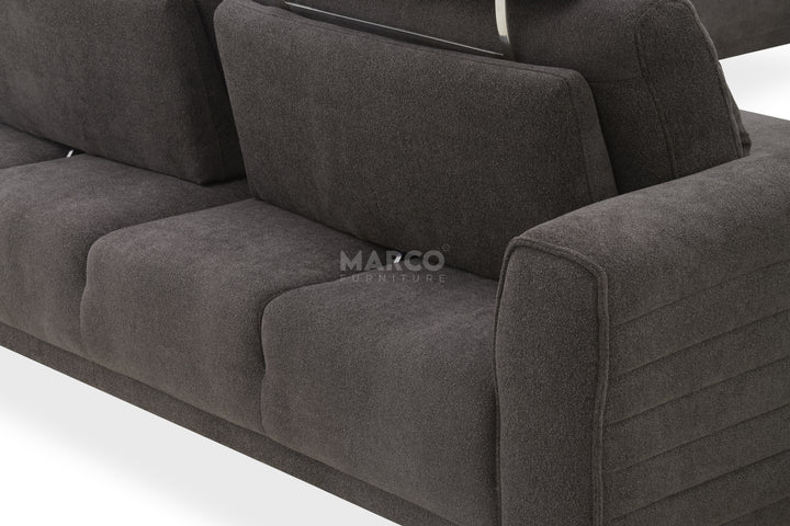 Gray sofa with 'Marco' branding on a white background